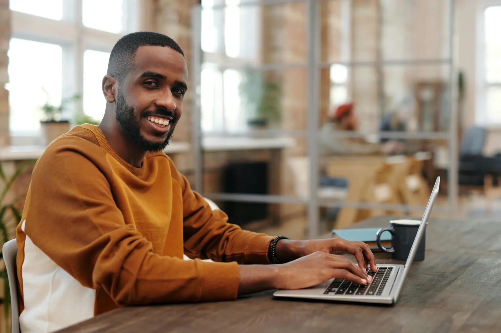 Professional working on a laptop in a modern office